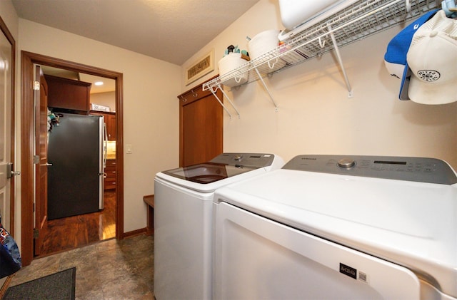 1324 Joshua Cir SE, Bondurant, IA 50035 - washroom featuring separate washer and dryer and baseboards
