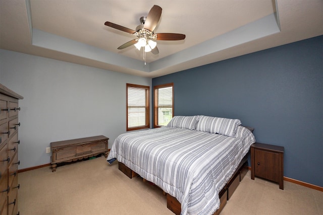 1324 Joshua Cir SE, Bondurant, IA 50035 - bedroom featuring a raised ceiling, carpet floors, and baseboards
