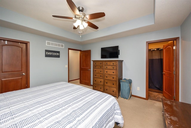 1324 Joshua Cir SE, Bondurant, IA 50035 - bedroom featuring a spacious closet, light colored carpet, baseboards, a raised ceiling, and a closet