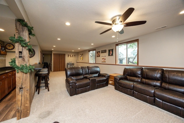 1324 Joshua Cir SE, Bondurant, IA 50035 - living room featuring carpet flooring, a ceiling fan, and recessed lighting