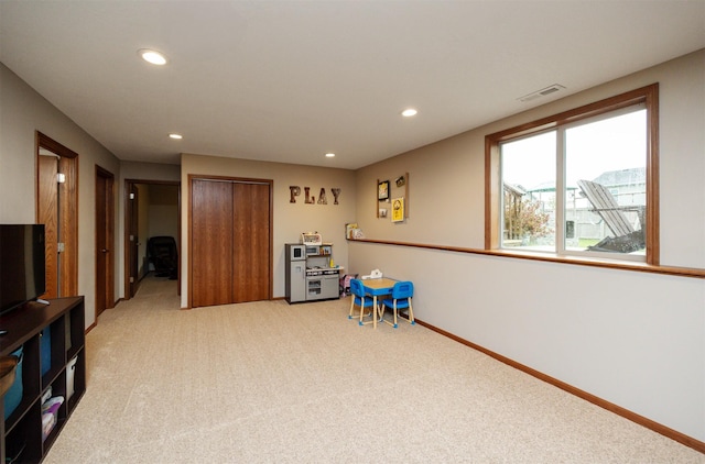 1324 Joshua Cir SE, Bondurant, IA 50035 - game room with light carpet, recessed lighting, and baseboards