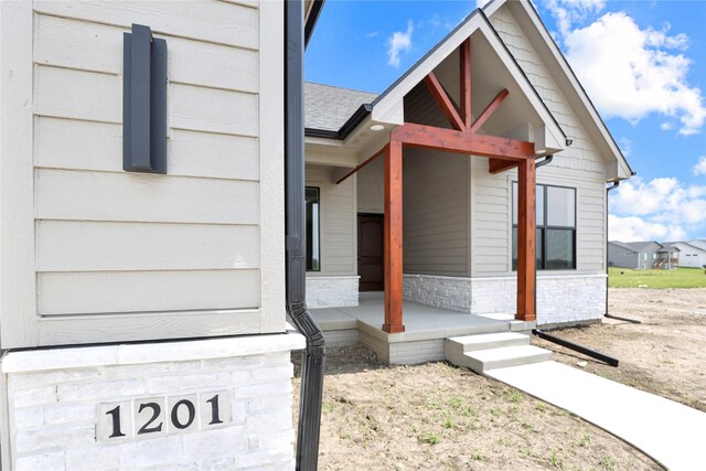 1201 Lakeview Cir NW, Bondurant, IA 50035 - view of exterior entry featuring stone siding