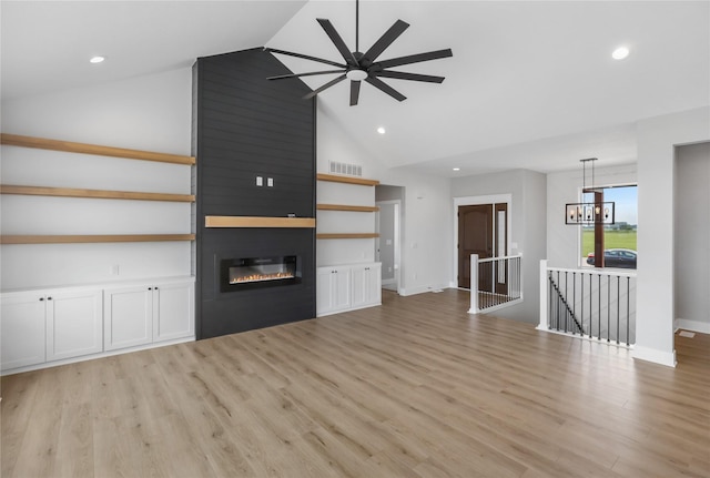 1201 Lakeview Cir NW, Bondurant, IA 50035 - unfurnished living room with recessed lighting, ceiling fan, light wood-style flooring, a fireplace, and high vaulted ceiling