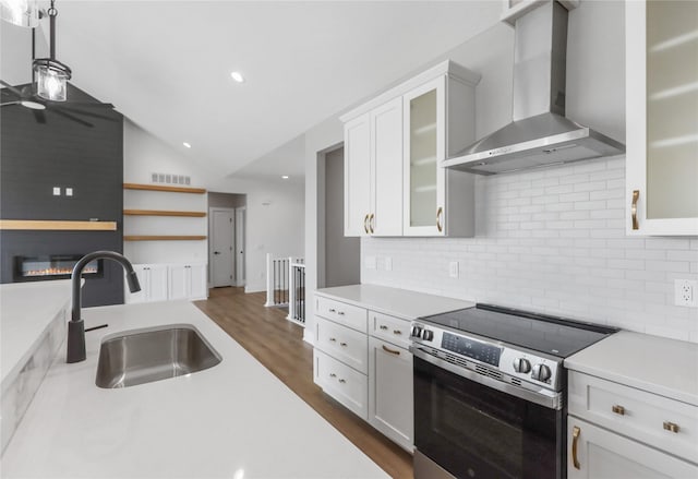 1201 Lakeview Cir NW, Bondurant, IA 50035 - kitchen featuring wall chimney exhaust hood, stainless steel electric range, a sink, light countertops, and tasteful backsplash