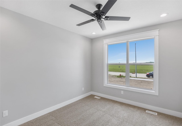1201 Lakeview Cir NW, Bondurant, IA 50035 - carpeted spare room featuring baseboards, a ceiling fan, and recessed lighting