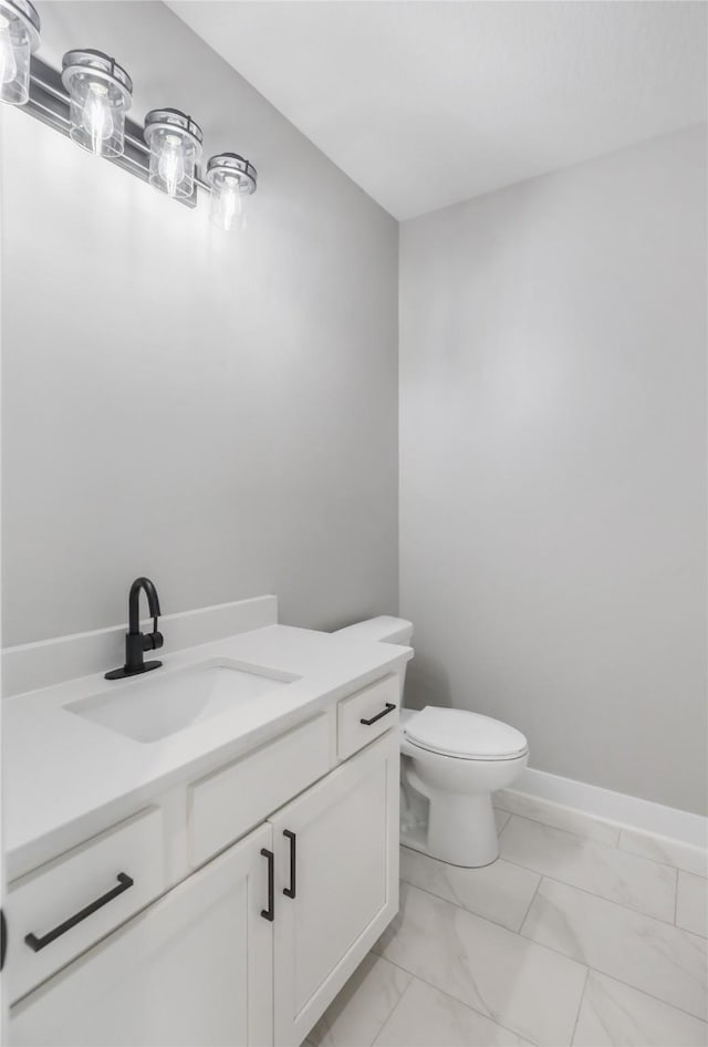 1201 Lakeview Cir NW, Bondurant, IA 50035 - half bath with marble look tiles, vanity, and toilet