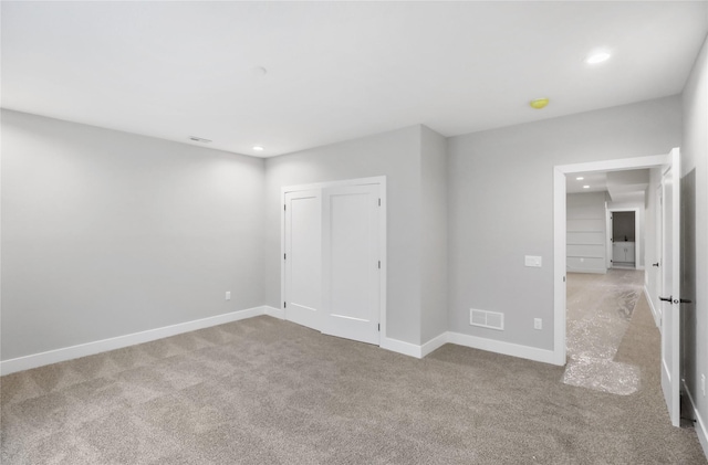 1201 Lakeview Cir NW, Bondurant, IA 50035 - unfurnished bedroom featuring carpet floors, recessed lighting, baseboards, and a closet