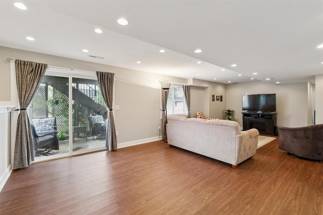 1822 30th Ave SW, Altoona, IA 50009 - living room featuring wood finished floors, baseboards, and recessed lighting