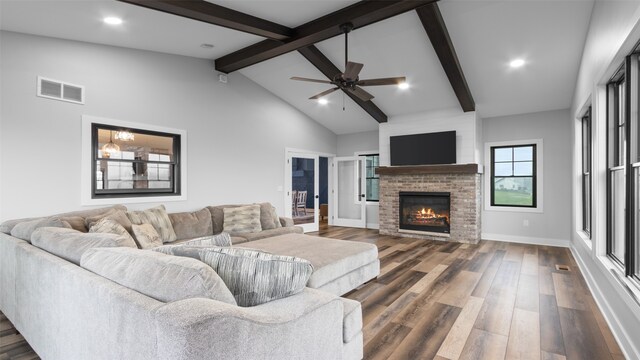 100 Coventry Ct, Clear Lake, IA 50428 - living area featuring dark wood-style flooring, a fireplace, a ceiling fan, baseboards, and recessed lighting