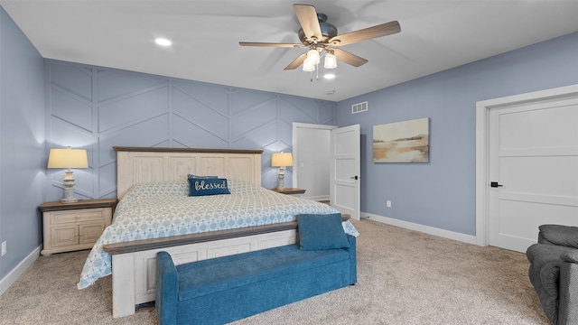 100 Coventry Ct, Clear Lake, IA 50428 - bedroom with light carpet, baseboards, recessed lighting, a decorative wall, and a ceiling fan