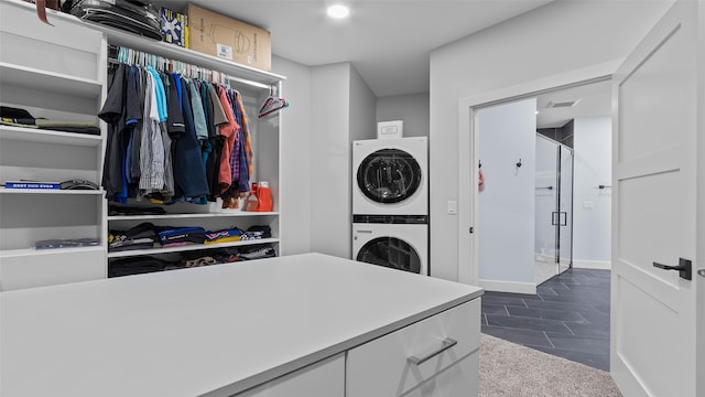 100 Coventry Ct, Clear Lake, IA 50428 - laundry area with stacked washer / dryer and baseboards