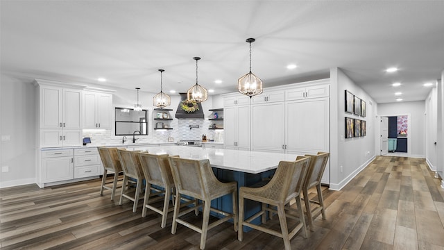 100 Coventry Ct, Clear Lake, IA 50428 - kitchen featuring open shelves, a chandelier, dark wood finished floors, backsplash, and recessed lighting