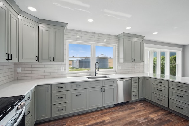 1026 44th Hwy, Guthrie Center, IA 50115 - kitchen featuring stainless steel appliances, a sink, gray cabinetry, recessed lighting, and backsplash