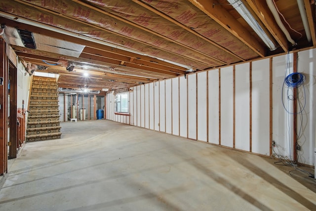 1026 44th Hwy, Guthrie Center, IA 50115 - basement featuring stairway