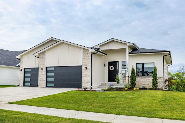 1030 Harrington Way, Waukee, IA 50263 - view of front of house featuring a garage, stone siding, a front yard, and concrete driveway