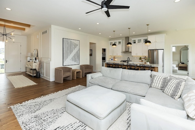 1030 Harrington Way, Waukee, IA 50263 - living room with dark wood-style flooring, ceiling fan, recessed lighting, and a chandelier