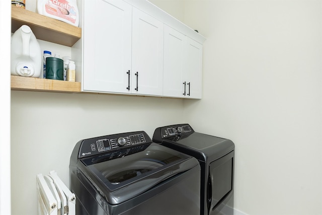 1030 Harrington Way, Waukee, IA 50263 - laundry area featuring separate washer and dryer and cabinet space