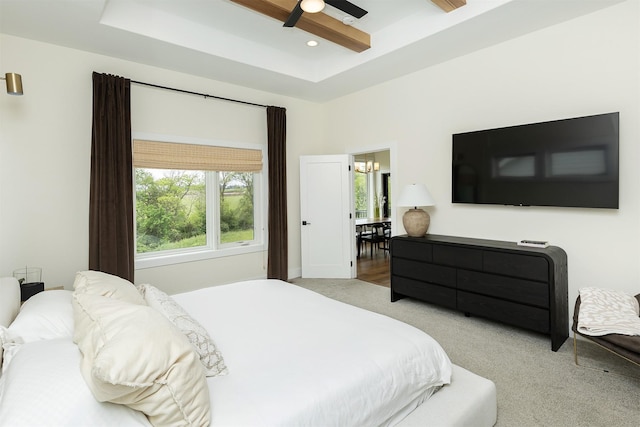 1030 Harrington Way, Waukee, IA 50263 - bedroom with carpet, multiple windows, a tray ceiling, and a ceiling fan