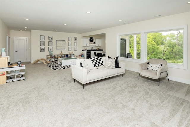 1030 Harrington Way, Waukee, IA 50263 - carpeted living room with recessed lighting and baseboards