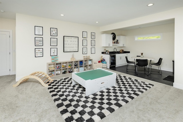 1030 Harrington Way, Waukee, IA 50263 - rec room with bar with sink, recessed lighting, dark carpet, and wine cooler