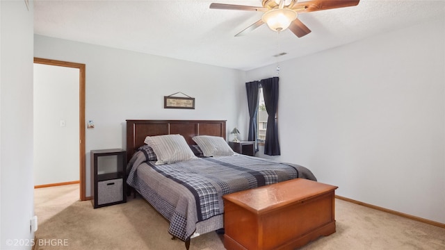 1105 E Henderson Pl, Indianola, IA 50125 - bedroom featuring light carpet, baseboards, and ceiling fan