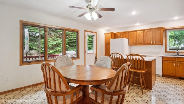 1105 E Henderson Pl, Indianola, IA 50125 - dining area with light floors, ceiling fan, recessed lighting, and baseboards