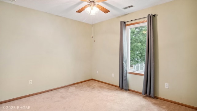 1105 E Henderson Pl, Indianola, IA 50125 - unfurnished room featuring light carpet, ceiling fan, and baseboards