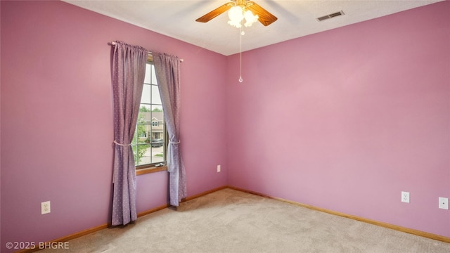 1105 E Henderson Pl, Indianola, IA 50125 - empty room featuring light colored carpet, a ceiling fan, and baseboards