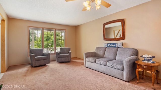 1105 E Henderson Pl, Indianola, IA 50125 - carpeted living area featuring a ceiling fan