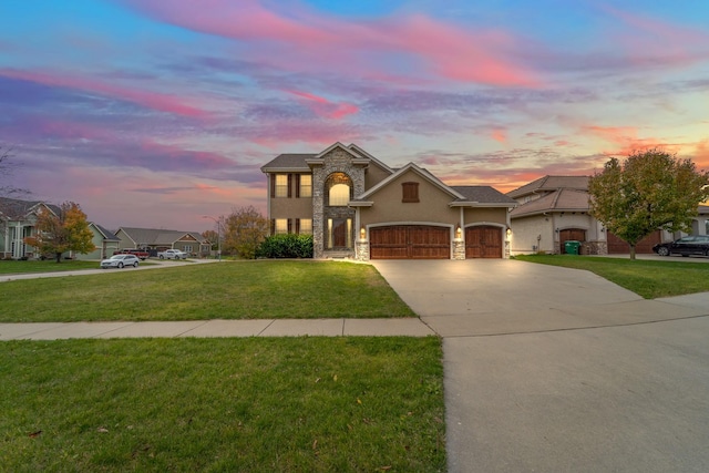 1738 Everwood Ct SW, Altoona, IA 50009 - traditional-style house featuring stone siding, stucco siding, a yard, and concrete driveway