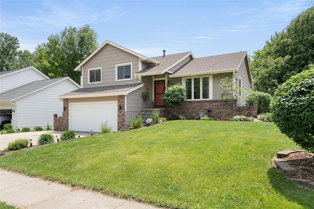 9640 Quail Run, Urbandale, IA 50322 - split level home with brick siding, driveway, a front yard, and a shingled roof