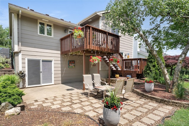 9640 Quail Run, Urbandale, IA 50322 - back of house with a deck, a patio area, and stairs