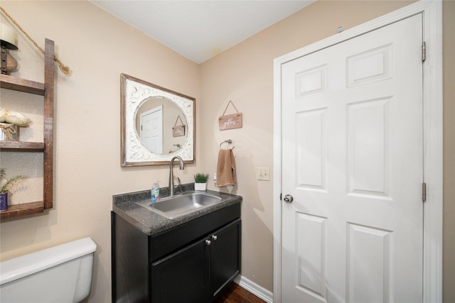 9640 Quail Run, Urbandale, IA 50322 - bathroom with vanity and toilet