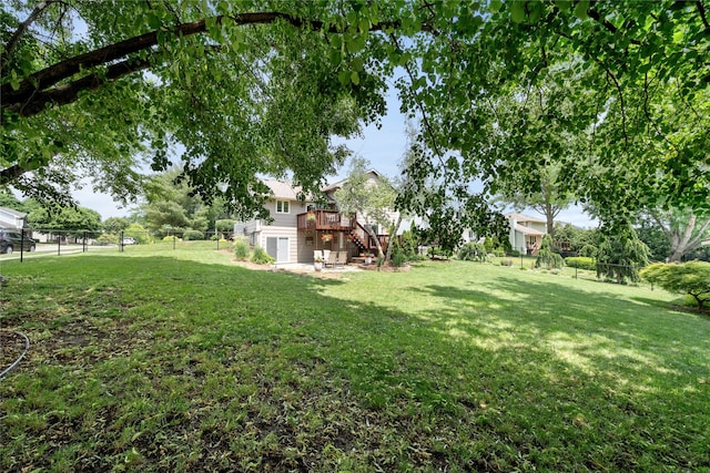 9640 Quail Run, Urbandale, IA 50322 - view of yard with stairs and a wooden deck