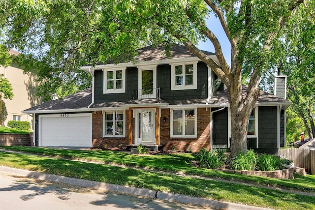 9873 Colby Ave, Clive, IA 50325 - view of front of property featuring a garage, brick siding, a chimney, and a shingled roof