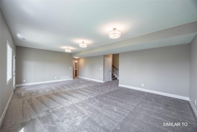 610 Ellis Cir, Adel, IA 50003 - empty room with stairway, baseboards, and carpet