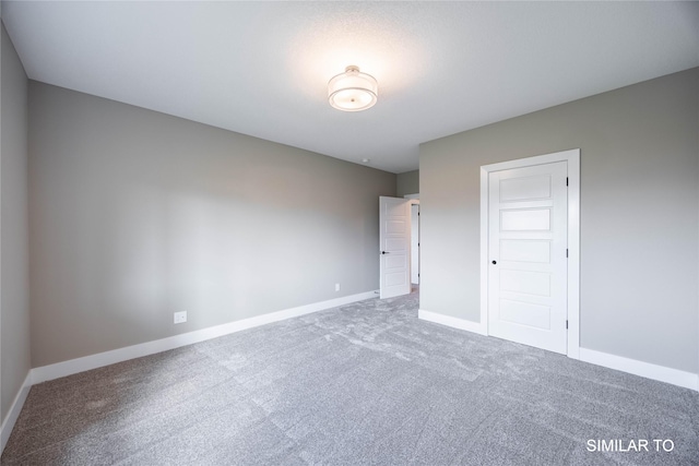 610 Ellis Cir, Adel, IA 50003 - carpeted empty room featuring baseboards