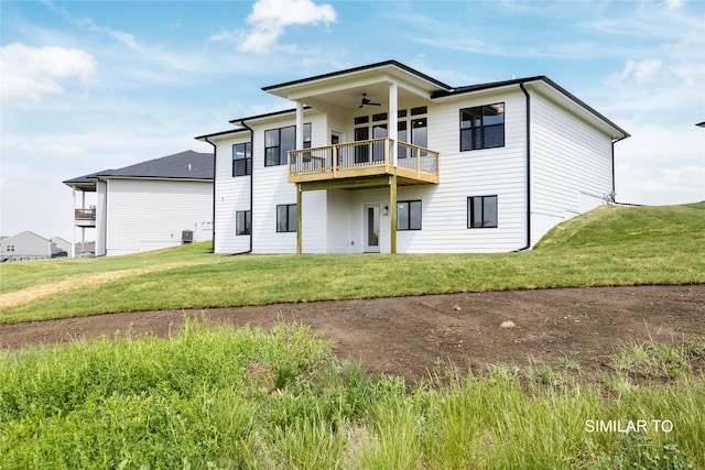 610 Ellis Cir, Adel, IA 50003 - rear view of property with ceiling fan, a lawn, and a balcony