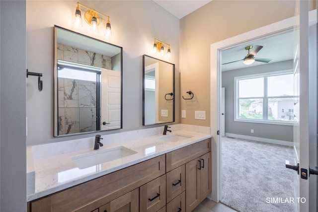 610 Ellis Cir, Adel, IA 50003 - full bathroom featuring double vanity, a marble finish shower, a ceiling fan, and baseboards