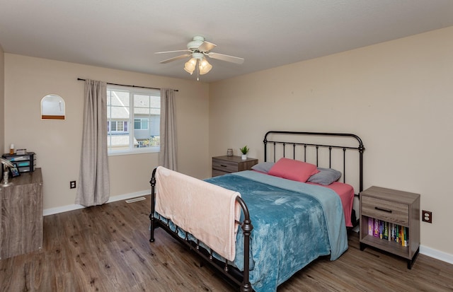 601 Orchard Hills Dr Unit 5011, Norwalk, IA 50211 - bedroom with wood finished floors, baseboards, and ceiling fan