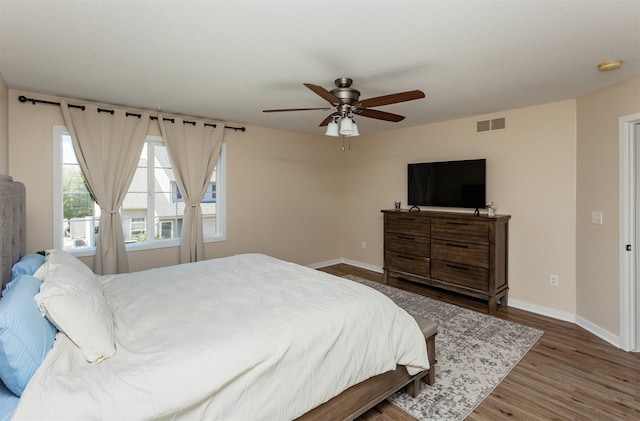 601 Orchard Hills Dr Unit 5011, Norwalk, IA 50211 - bedroom featuring baseboards, wood finished floors, and ceiling fan