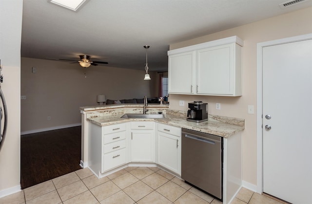 601 Orchard Hills Dr Unit 5011, Norwalk, IA 50211 - kitchen with dishwasher, a sink, a peninsula, and white cabinets