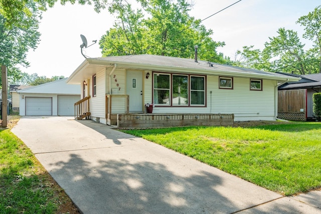 2607 E 39th St, Des Moines, IA 50317 - ranch-style house with an outbuilding, a detached garage, and a front yard