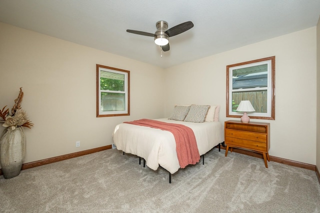 2607 E 39th St, Des Moines, IA 50317 - carpeted bedroom featuring baseboards and a ceiling fan