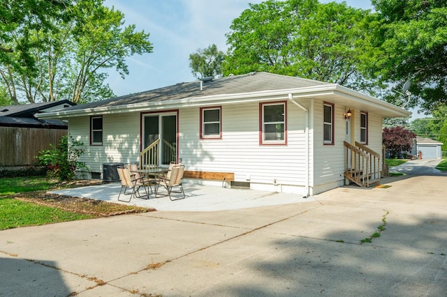2607 E 39th St, Des Moines, IA 50317 - rear view of house with entry steps and a patio area