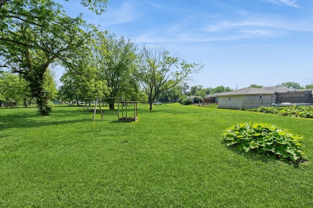 3811 E 30th St, Des Moines, IA 50317 - view of yard with a trampoline