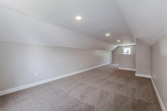 3811 E 30th St, Des Moines, IA 50317 - bonus room featuring carpet flooring, vaulted ceiling, baseboards, and recessed lighting