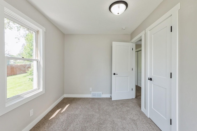 3811 E 30th St, Des Moines, IA 50317 - unfurnished bedroom featuring carpet and baseboards