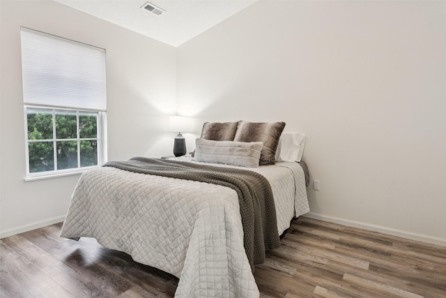 2150 NE 18th St Unit 101, Grimes, IA 50111 - bedroom featuring wood finished floors and baseboards
