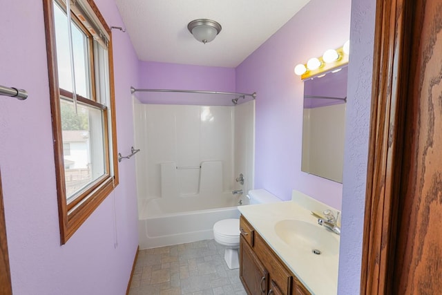 102 Jackson St, Pella, IA 50219 - full bath featuring toilet, vanity, and bathtub / shower combination